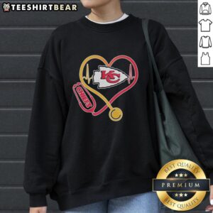 Top Nurse Heartbeat Kansas City Chiefs Logo Sweatshirt showcasing a stylish design for fans and healthcare professionals.