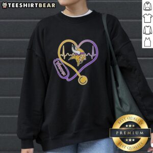 Alt Text: Top Nurse Heartbeat X Minnesota Vikings Logo Sweatshirt featuring vibrant team colors and a stylish design.