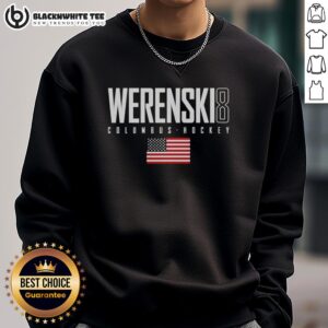 Zach Werenski wearing a Columbus Blue Jackets USA flag elite sweatshirt, showcasing team pride and style.