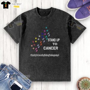 Person wearing a washed t-shirt featuring a dog paw print design for the Stand Up To Cancer dog walking challenge.