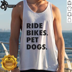 Person wearing a Nice Ride Bikes tank top with pet dogs, enjoying a sunny day outdoors.