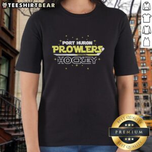 Alt Text: Original Port Huron Prowlers hockey team yellow text design with stars and stick on a ladies tee shirt.