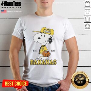 Alt Text: Cute Snoopy wearing a Savannah Bananas outfit with Est 2016 on a trendy t-shirt, perfect for fans and collectors.