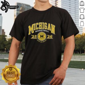 Premium University of Michigan 2025-2026 basketball 'Let's Go Blue' T-shirt featuring team colors and logo.