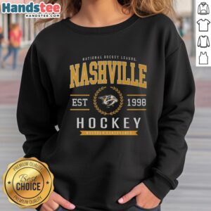 Alt Text: Official Nashville Predators Hockey Legacy Crest Sweatshirt featuring team logo and vibrant colors for fans.
