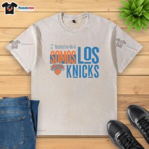 Alt Text: Official New York Knicks Noches Ene Be A Somos Los Knicks washed t-shirt for fans of Knicks basketball apparel.