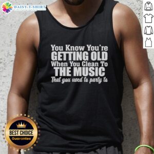 Funny tank top saying 'You know you're getting old when you clean to the music you used to party to' in bright colors.