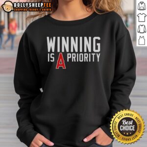 Nice Los Angeles Angels Winning is Angels Priority sweatshirt featuring the team's logo and vibrant colors.
