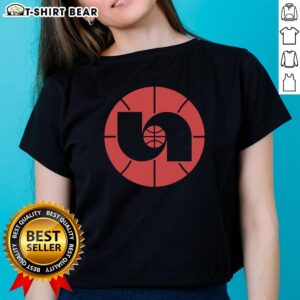 Alt Text: 1980s Nebraska Basketball logo on a ladies tee, showcasing vintage sports design and team pride.