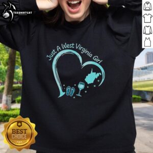 Stylized sweatshirt featuring 'Just A West Virginia Girl' with slippers and a wine glass, perfect for West Virginia lovers.
