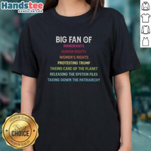 Protesters wearing 'Nice Big Fan of Immigrants' tees advocate for human rights and climate action during a rally against Trump.