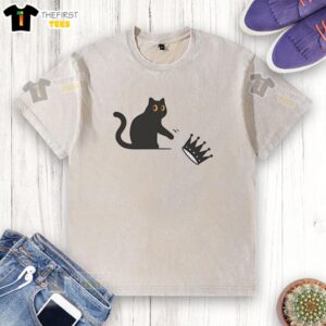 Alt Text: Pretty black cat wearing a crown on a no kings American washed t-shirt, showcasing a playful design.