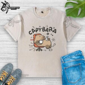 Relaxing capybara on an office chair wearing a washed t-shirt, showcasing a cozy and charming workspace vibe.