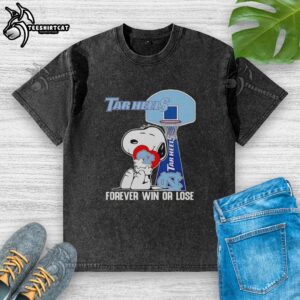 Original Snoopy holding a North Carolina Tar Heels heart on a washed t-shirt, celebrating win or lose spirit.