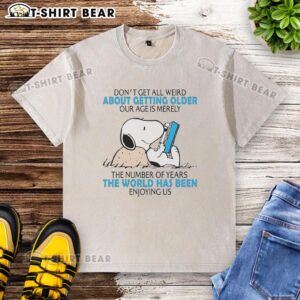 Official Snoopy Don't Get All Weird About Getting Older T-shirt featuring a fun age quote on a washed design.