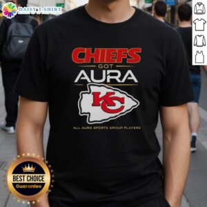Top Kansas City Chiefs players wearing Got Aura All Aura Sports Group T-shirt at a game, showcasing team spirit.