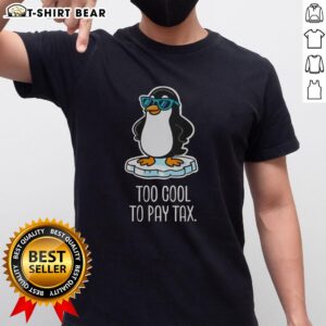 Top Penguins Against Tariffs Too Cool To Pay Tax T-Shirt featuring playful penguins and a bold tax protest message.