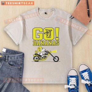 Premium Snoopy and Woodstock driving on a Savannah with bananas, featuring a fun washed t-shirt design.
