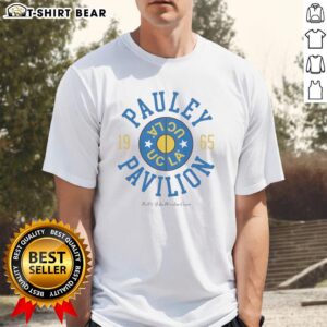 Alt Text: Official UCLA Nell and John Wooden Court T-shirt from 1995, featuring iconic Pauley Pavilion design and colors.