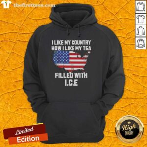 Cozy 'I Like My Country How I Like My Tea Filled With Ice' hoodie displayed on a wooden surface, perfect for casual wear.