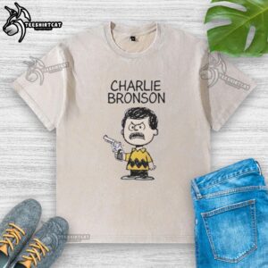 Stylish washed t-shirt featuring a Charlie Bronson action movie mashup design, perfect for film enthusiasts and casual wear.