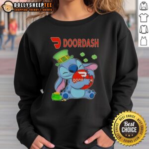 Top Stitch Hug DoorDash logo St. Patrick's Day sweatshirt featuring festive green design and shamrock accents.