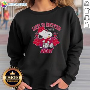 Snoopy wearing a Miami Heat logo sweatshirt with 'Life Is Better With Heat' text, showcasing team spirit.
