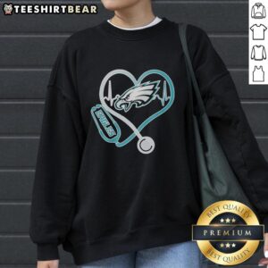 Top Nurse Heartbeat X Philadelphia Eagles logo sweatshirt for nurses and football fans, combining style and team spirit.
