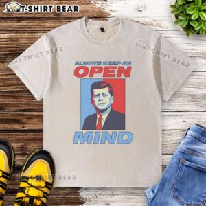 Retro washed t-shirt featuring a portrait of John F. Kennedy with the quote 'Always Keep An Open Mind'.
