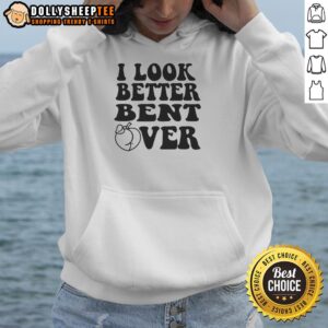 Stylish person wearing an 'I Look Better Bent Over' hoodie, showcasing a trendy casual outfit in a vibrant urban setting.