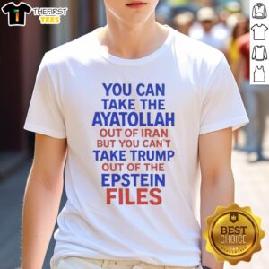 Alt Text: Humorous t-shirt with the phrase 'You Can Take The Ayatollah Out Of Iran But You Can't Take Trump Out Of The Epstein Files.'