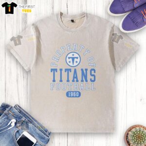 Premium Tennessee Titans Football Property 1960 Washed T-Shirt in blue, featuring team logo and vintage design.