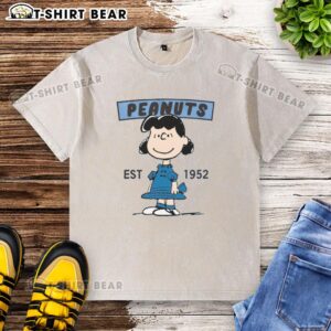 Pretty Peanuts Lucy Smile Est 1952 washed t-shirt featuring a vibrant graphic of Lucy from the Peanuts comic strip.