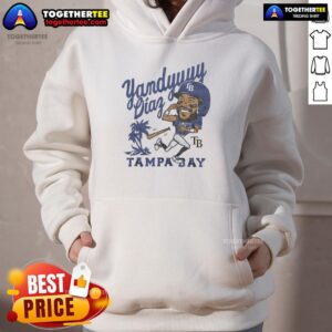 Alt Text: Yandy Diaz wearing a stylish Tampa Bay Rays hoodie, showcasing team spirit at a baseball game.
