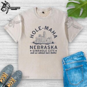 Pretty Hole Maha Nebraska Sinkhole City washed t-shirt featuring a unique, artistic design and vibrant colors.