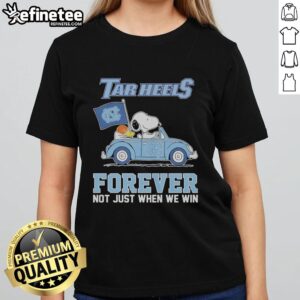 Original Snoopy and Woodstock diving design on a North Carolina Tar Heels ladies tee, perfect for fans all season long.