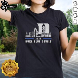 Alt Text: Premium 2026 Duke Blue Devils basketball ladies tee featuring all names and a city skyline design.