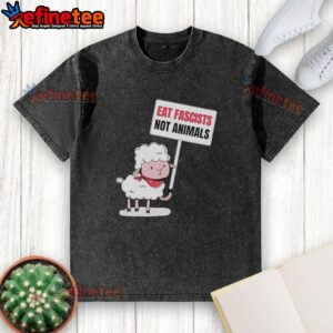 Alt Text: Funny washed t-shirt featuring an original sheep holding a sign that says Eat Fascists, Not Animals.