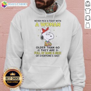 Good Peanuts Snoopy hoodie featuring a humorous quote about women over 60 and their fierce attitude.