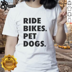 Two ladies enjoying a Nice Ride on bikes with their pet dogs, showcasing a fun outdoor adventure in a sunny park.