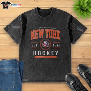 Alt Text: Official New York Islanders Hockey Legacy Crest Washed T-Shirt featuring team colors and logo for fans and collectors.