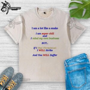 Chill washed t-shirt featuring a snake graphic and the phrase 'I Am A Lot Like A Snake, I Mind My Own Business'.