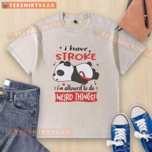 Lazy panda wearing a red ribbon on a washed T-shirt, showcasing its quirky personality and charm in a playful pose.