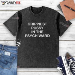 Good-Grippiest Pussy In The Psych Ward washed t-shirt displayed on a hanger, showcasing its unique design and vibrant colors.