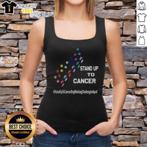 Person wearing a tank top with 'Stand Up to Cancer' and dog paw prints, promoting the April dog walking challenge.