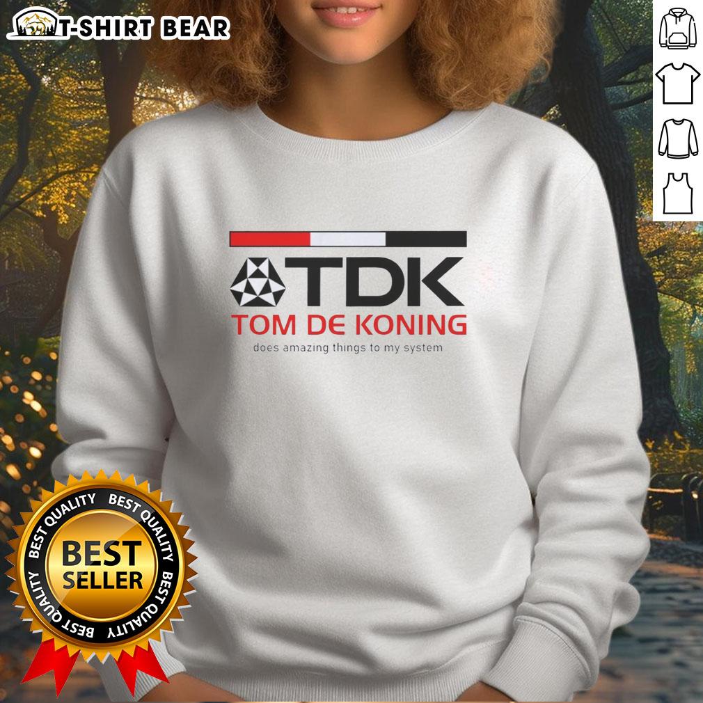 Awesome Tdk Corporate Mark Tom De Koning Does Amazing Things To My System Sweatshirt Tom De Koning wearing an Awesome TDK corporate sweatshirt, showcasing a stylish design and promoting 'Amazing Things to My System'.