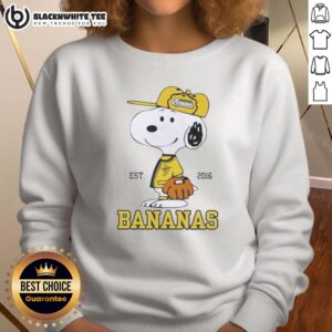 Alt Text: Cozy Pretty Peanuts Snoopy x Savannah Bananas sweatshirt established 2016, featuring vibrant graphics and playful design.