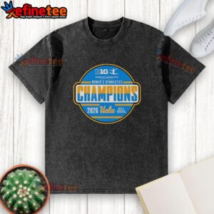 Alt Text: Premium UCLA Bruins Big Ten Women's Gymnastics Tournament Champions washed t-shirt displayed on a wooden background.
