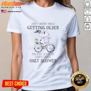Alt Text: Premium Peanuts Snoopy tee featuring Don't Worry About Getting Older quote, perfect for fans of classic cartoons.