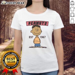 Pretty Peanuts Franklin Est 1967 Ladies Tee featuring a stylish graphic design of Franklin from Peanuts.